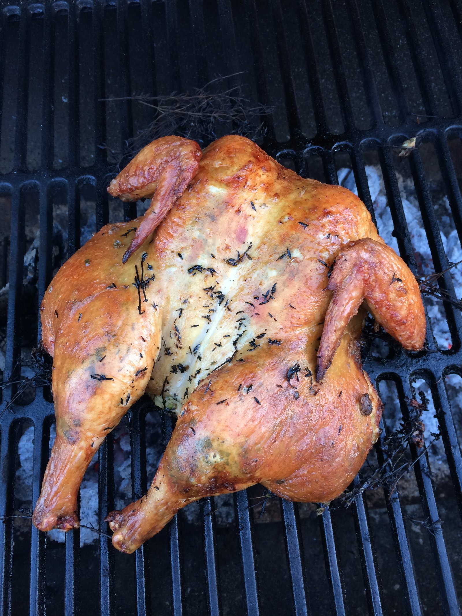 butterflied chicken grilled on a bed of thyme